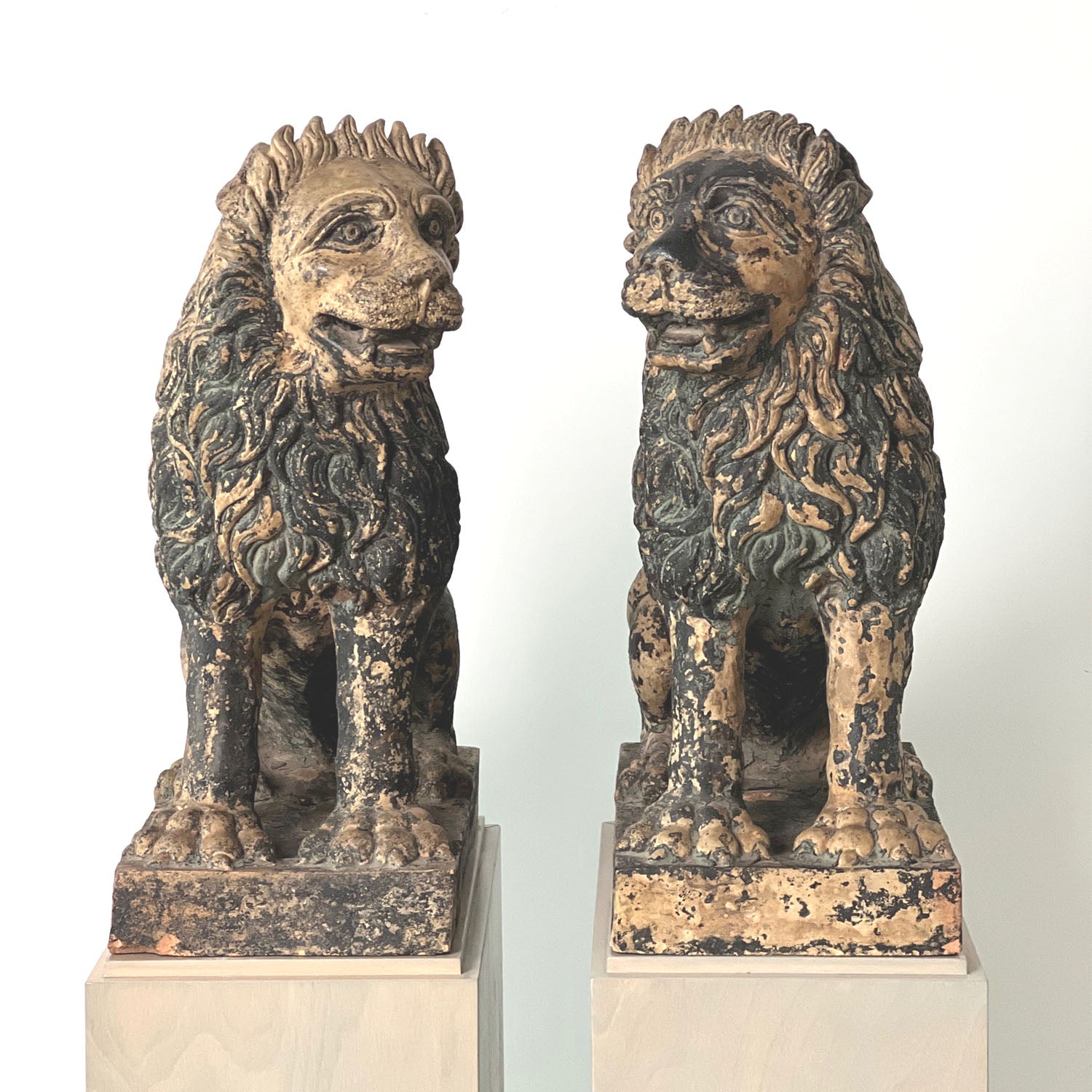 TERRACOTTA PAINTED SEATED LIONS