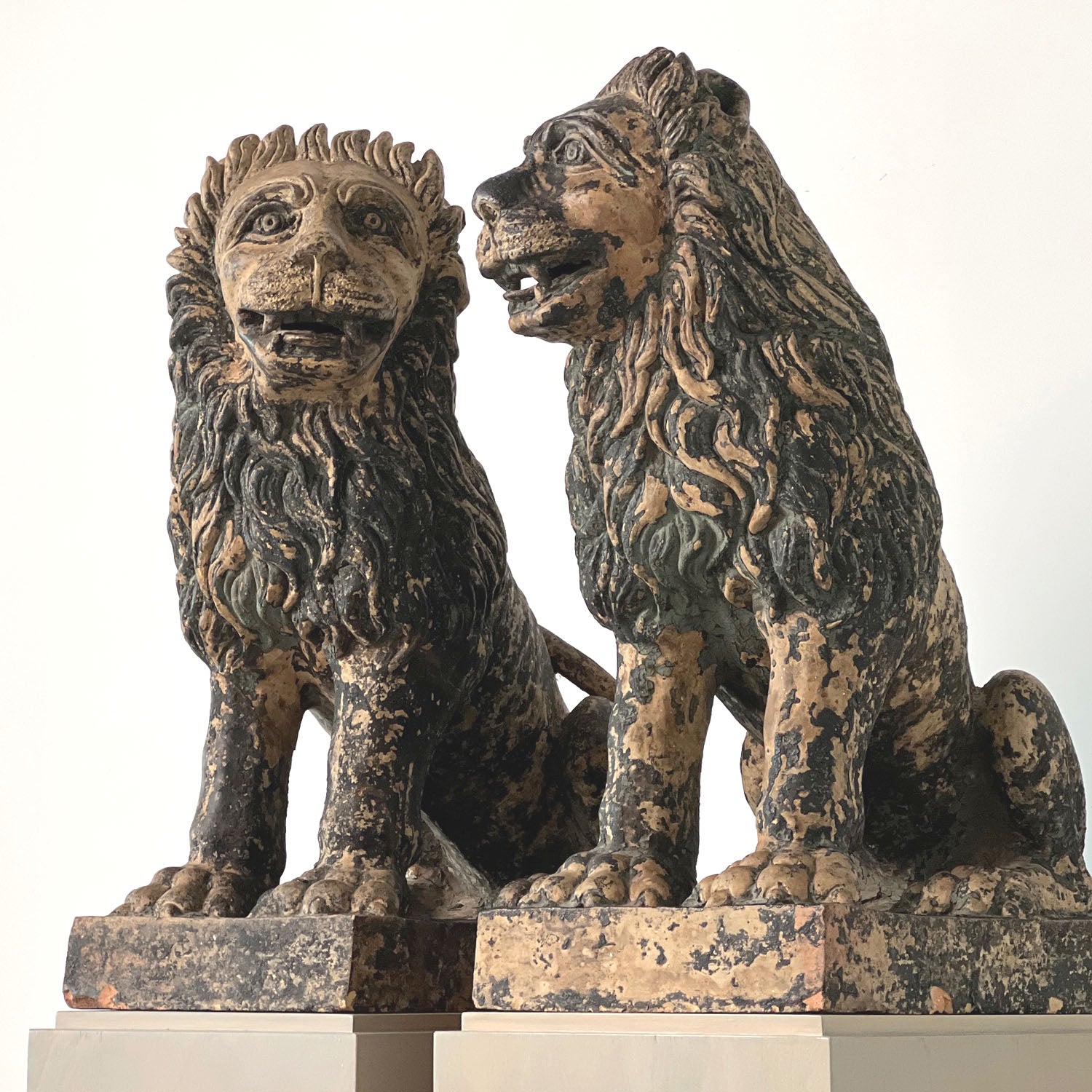 TERRACOTTA PAINTED SEATED LIONS