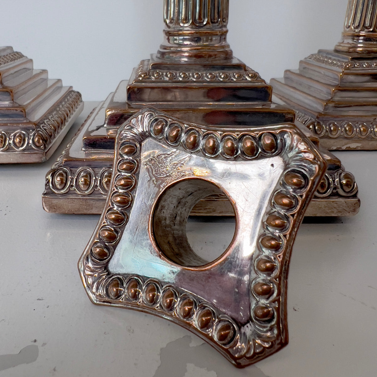 CORINTHIAN COLUMN SILVER-PLATED CANDLESTICKS - FOUR